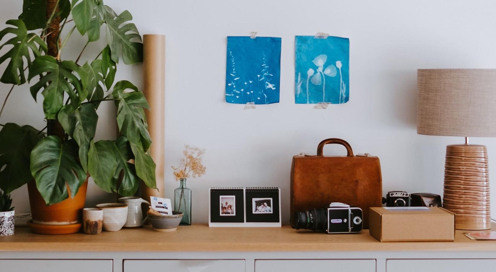 large dresser with a variety of decor on it